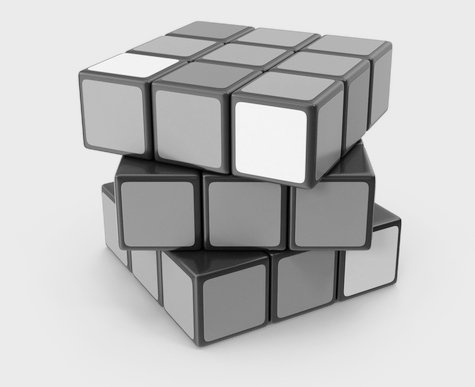Contacto Cubo de rubik en blanco y negro. Fondo sólido en color gris.